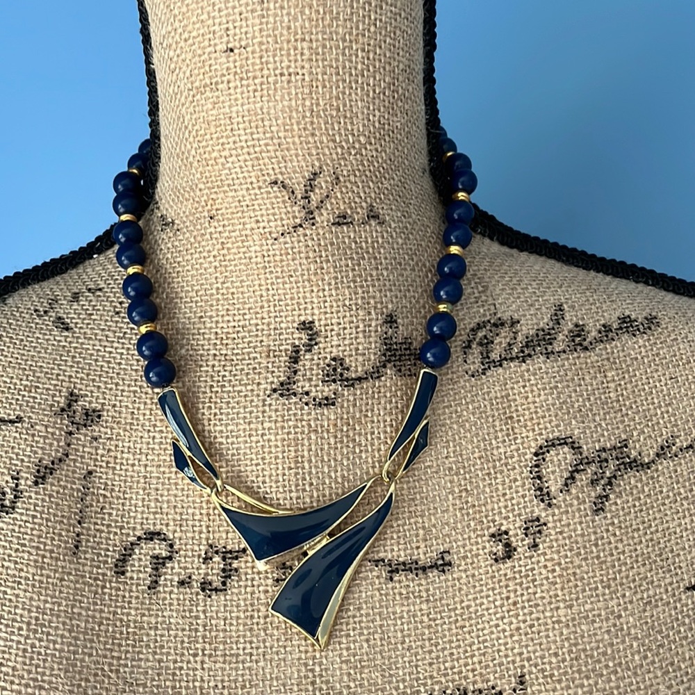 Vintage acrylic blue beaded statement necklace with blue enamel focal piece 18”